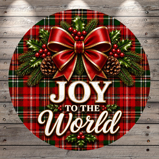 A festive Christmas-themed image featuring a red bow, pine cones, holly leaves, and berries, with the text "JOY to the World" displayed prominently.