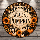 A decorative circular sign with the text "Hello Pumpkin" surrounded by various autumn-themed elements such as sunflowers, pumpkins, and gourds.