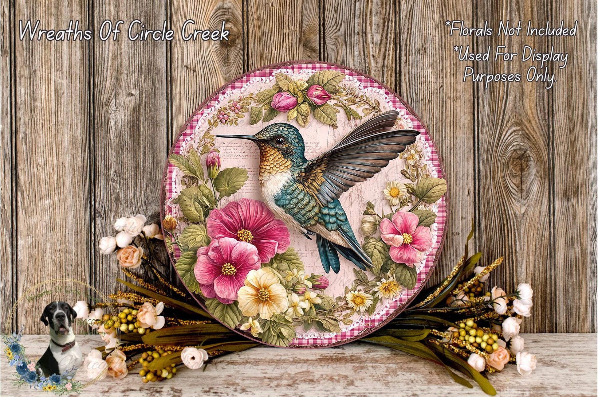A decorative plate featuring a colorful bird, surrounded by a floral arrangement and placed on a wooden surface.