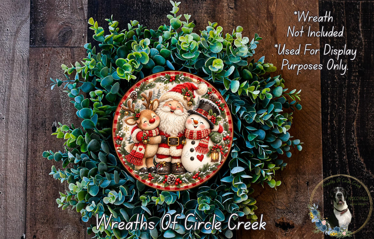 A wreath made of evergreen branches and featuring a Santa Claus, reindeer, and snowman.