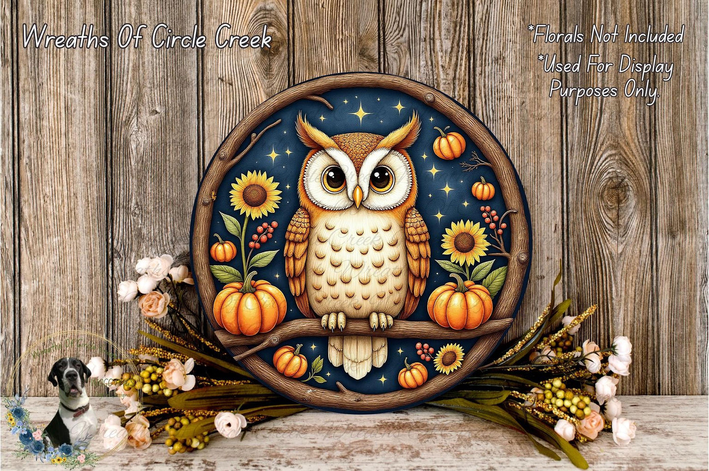 A circular wall hanging depicting an owl perched on a branch, surrounded by autumnal elements such as pumpkins, sunflowers, and flowers. The owl is set against a dark background with a starry night sky.
