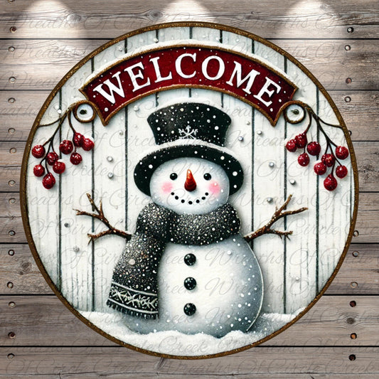 A snowman wearing a black top hat and scarf, with a red banner that says "Welcome" above it, is surrounded by red berries and branches against a wooden background.