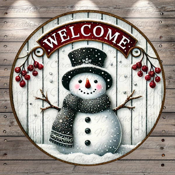 A snowman wearing a black top hat and scarf, with a red banner that says "Welcome" above it, is surrounded by red berries and branches against a wooden background.