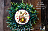 A wreath made of green leaves and a baseball-themed decoration, with the text "Tis the Season" and a baseball bat.