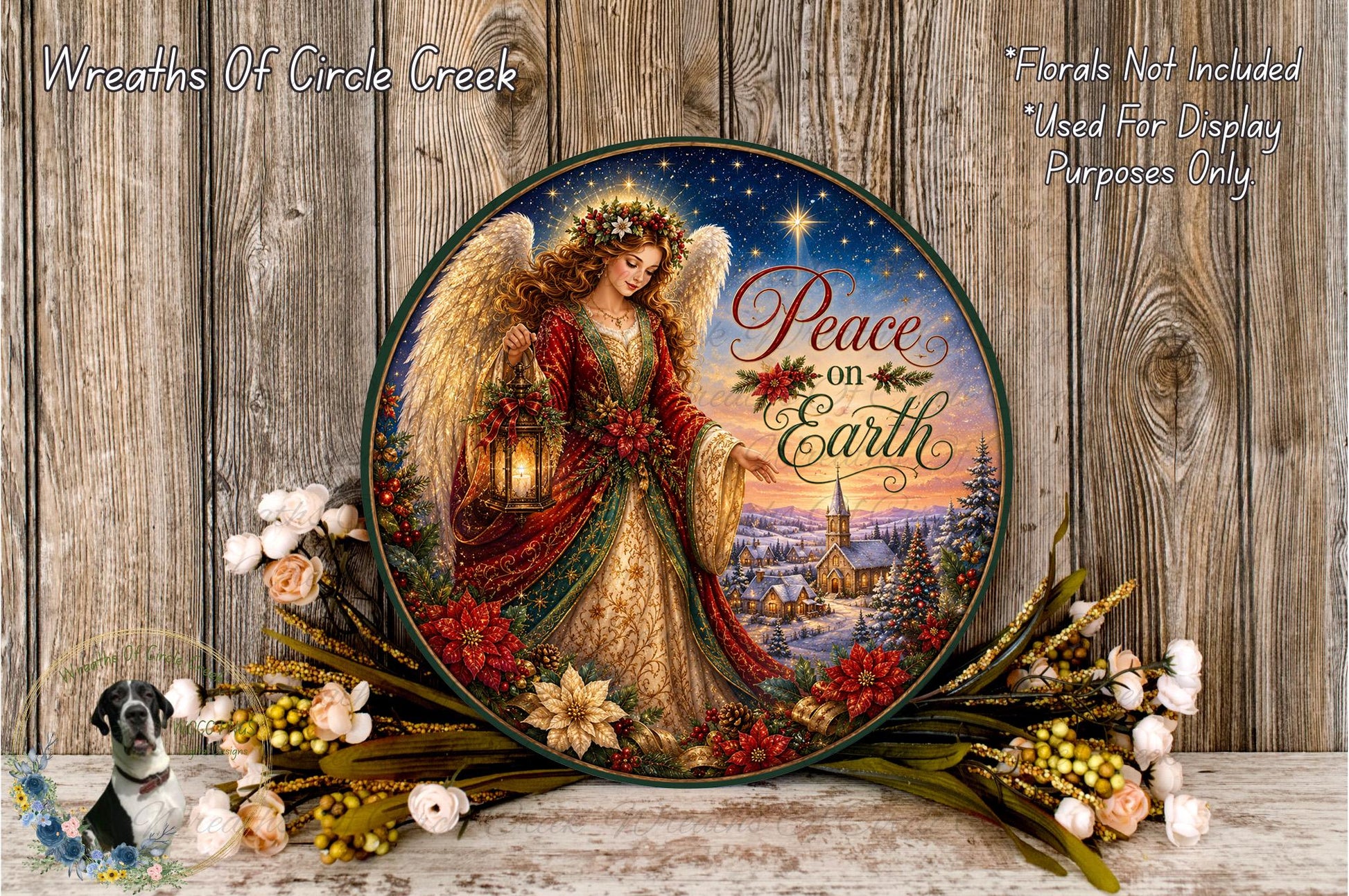 A decorative plate featuring an angel holding a lantern and surrounded by flowers, with a snowy landscape in the background.
