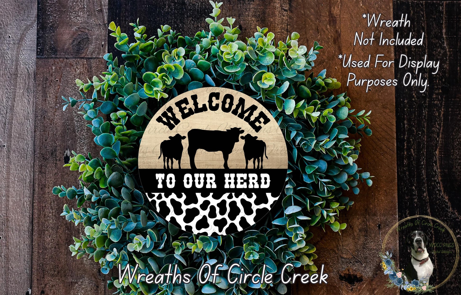 a wreath made of green foliage and a wooden sign that reads "Welcome to our herd". The sign also includes a silhouette of a cow and the text "Wreaths of Circle Creek".