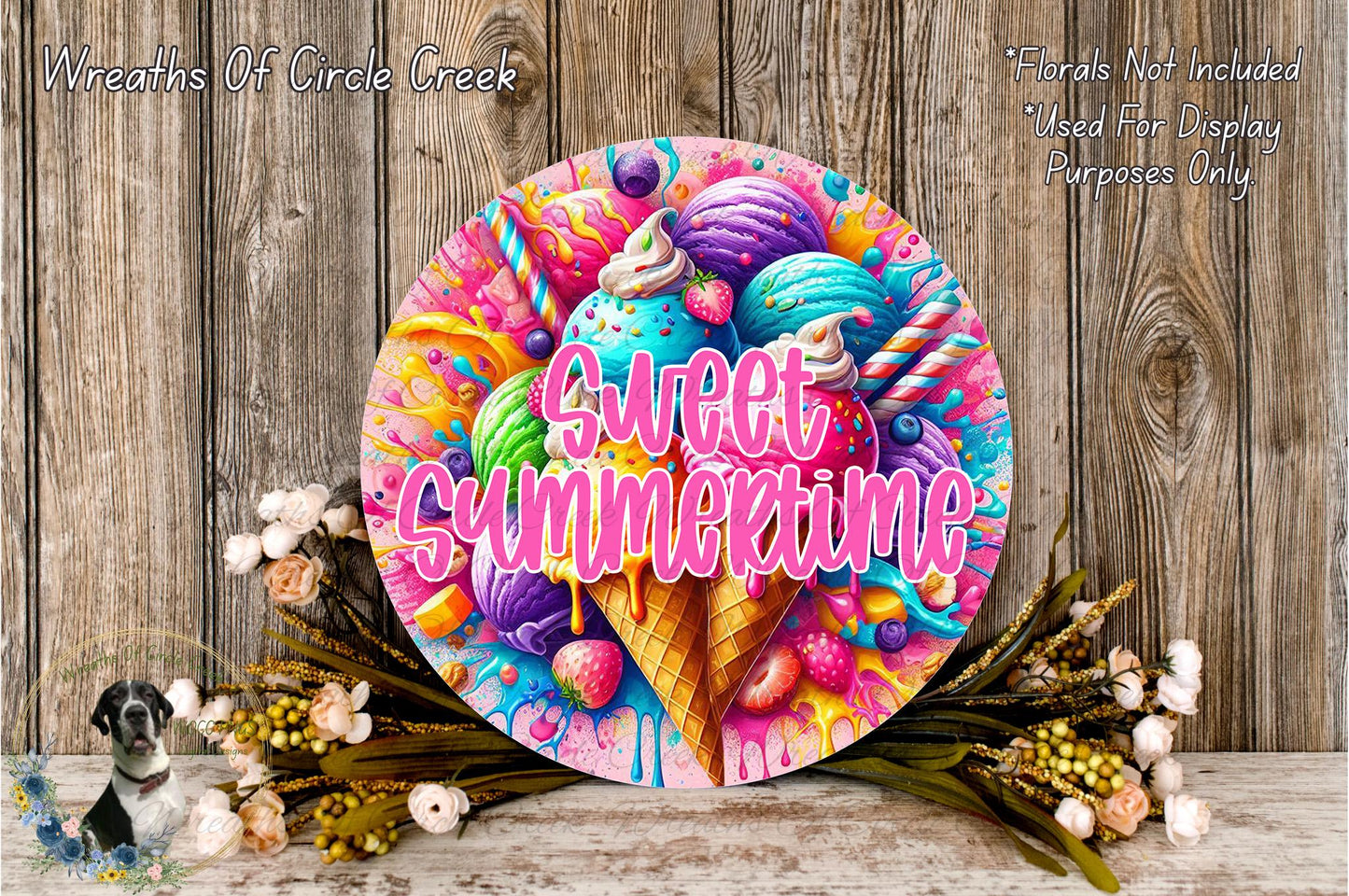 a colorful and whimsical wreath with the text "Sweet Summertime" written on it, surrounded by various ice cream flavors and toppings. The wreath is displayed on a wooden surface, with flowers and greenery adding to the overall aesthetic.
