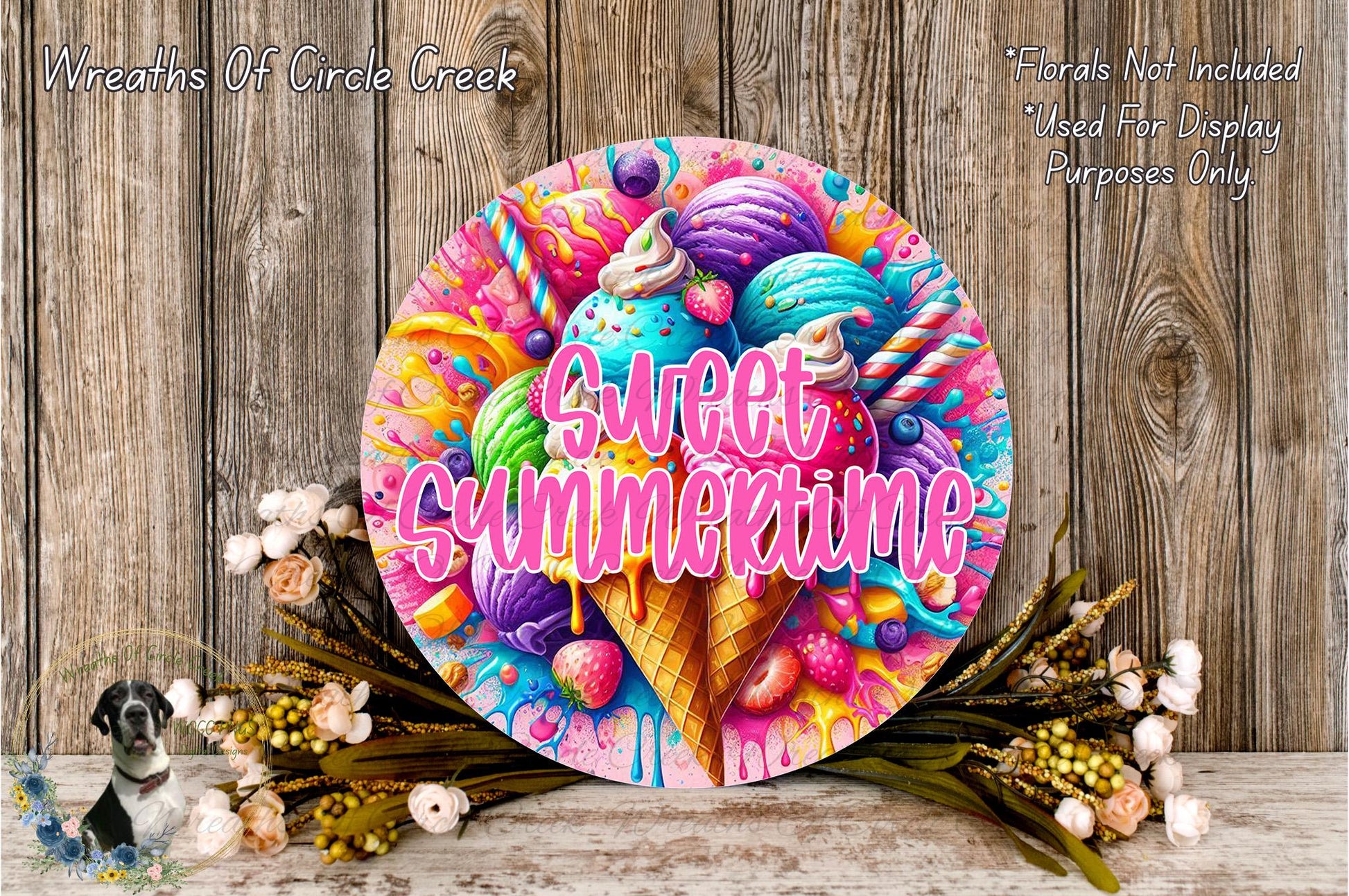 a colorful and whimsical wreath with the text "Sweet Summertime" written on it, surrounded by various ice cream flavors and toppings. The wreath is displayed on a wooden surface, with flowers and greenery adding to the overall aesthetic.