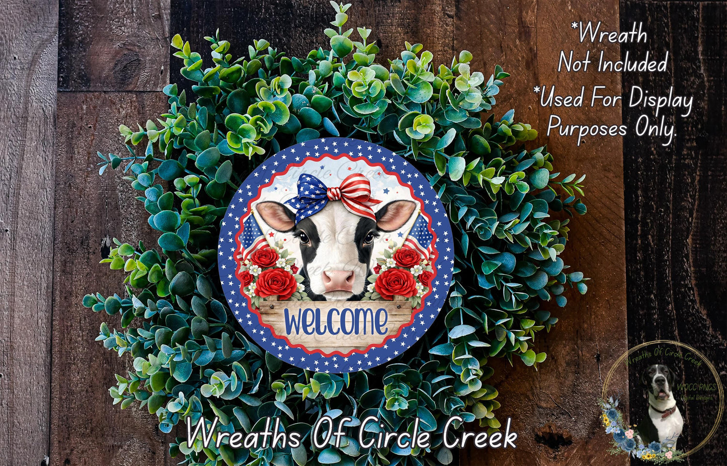 a wreath with a cow's head and a patriotic design, surrounded by greenery. The wreath is displayed on a wooden surface, and there is a text overlay that reads "Welcome Wreath Not Included * Used For Display Purposes Only".