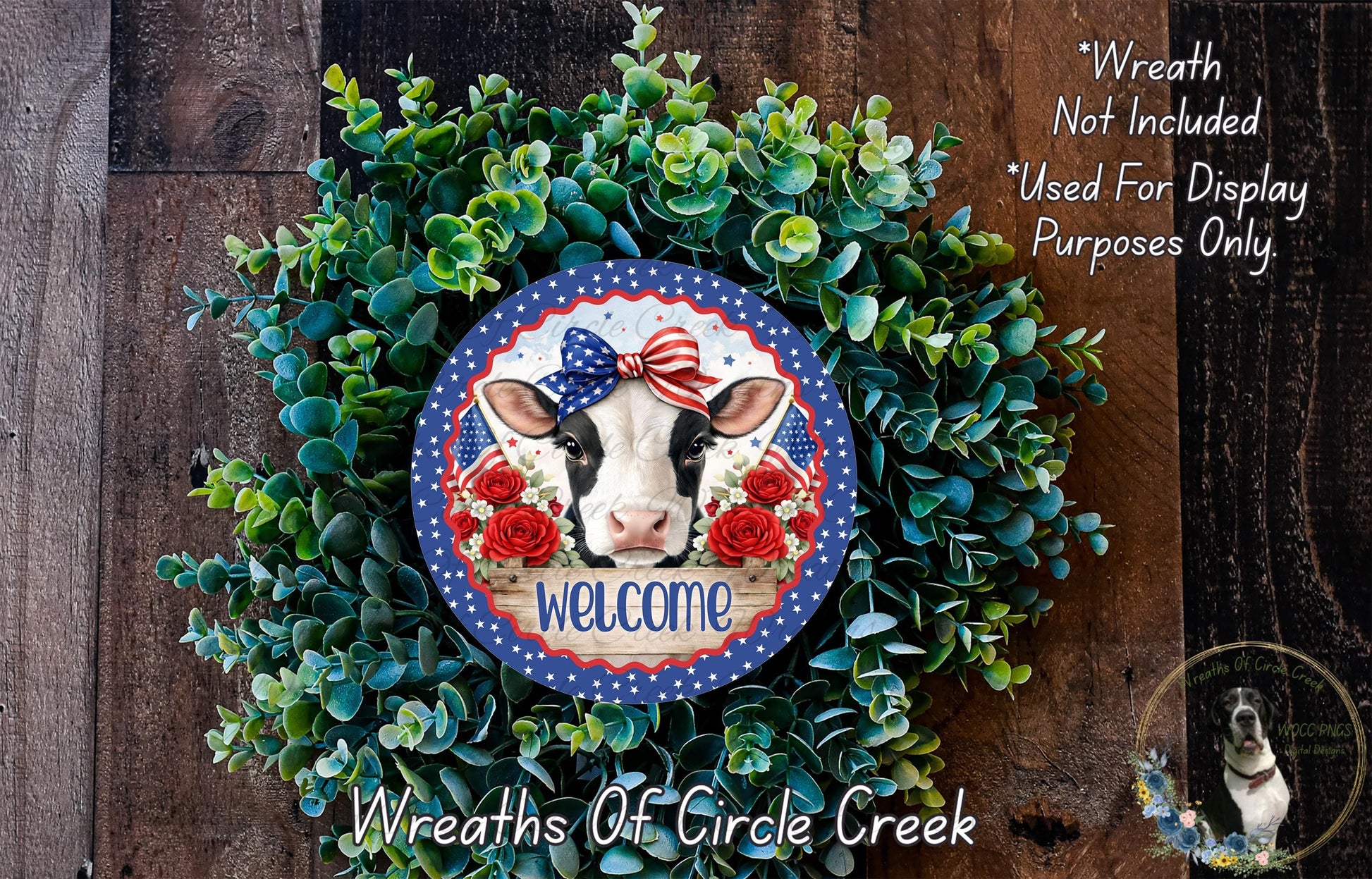 a wreath with a cow's head and a patriotic design, surrounded by greenery. The wreath is displayed on a wooden surface, and there is a text overlay that reads "Welcome Wreath Not Included * Used For Display Purposes Only".