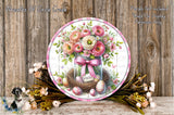 A decorative round plate with a floral arrangement, including a jar filled with flowers, a bow, and Easter eggs, placed on a wooden surface.