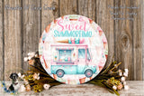 a round sign with a colorful illustration of an ice cream truck, surrounded by flowers and greenery.