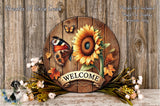 a wooden sign with a sunflower and butterfly design, surrounded by autumn leaves and flowers, with the word "WELCOME" displayed on the sign.