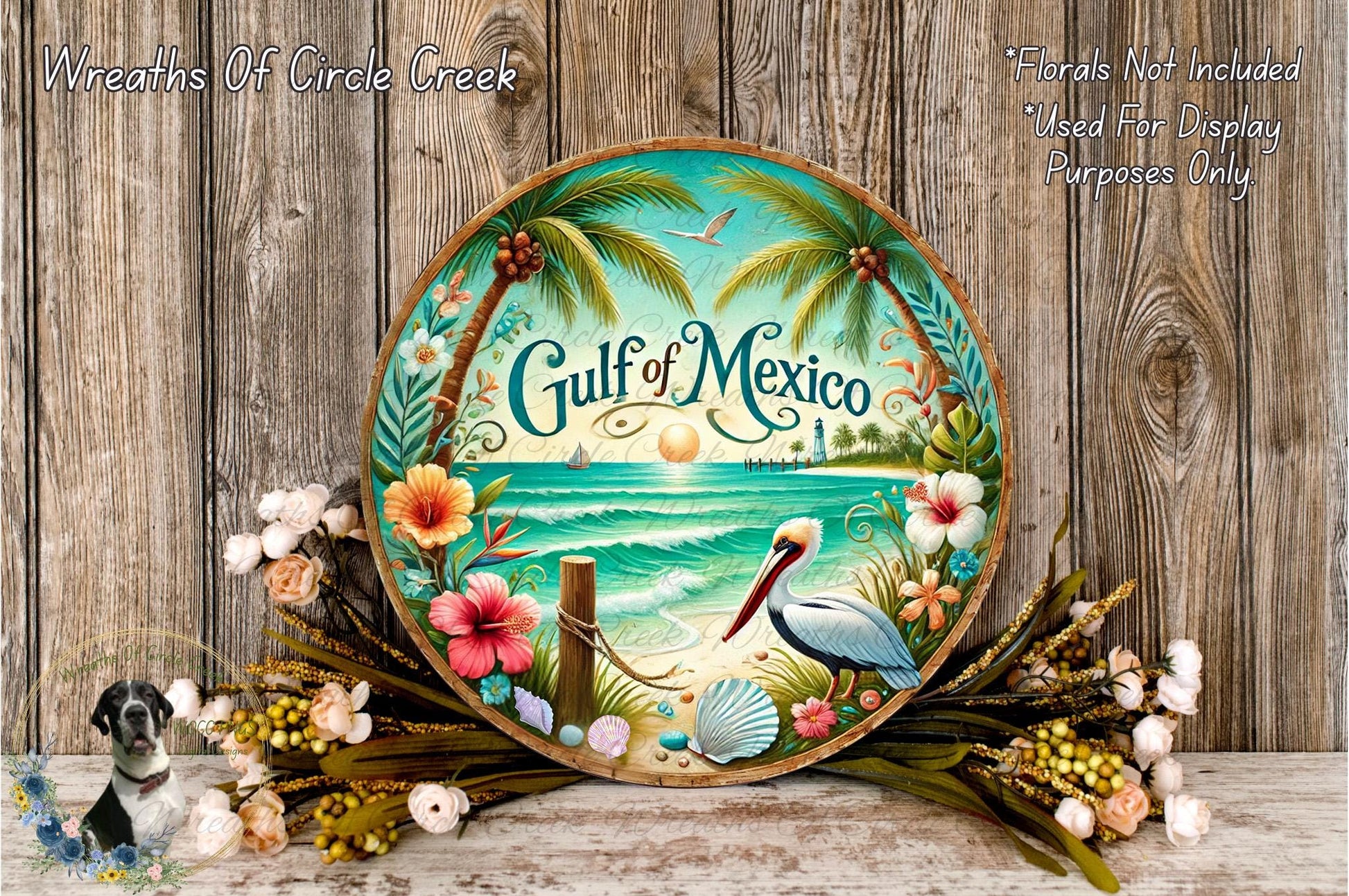 a decorative plate with a tropical beach scene, including palm trees, flowers, and a bird, set against a wooden background.