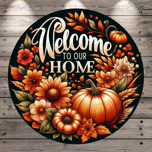 A circular sign with a black background featuring a vibrant autumnal design with flowers, pumpkins, and leaves. The text "Welcome to our Home" is prominently displayed in the center of the sign.