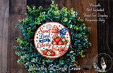 a wreath made of green foliage and a circular sign with the text "Sweet Land of Liberty" and a basket of strawberries. The sign is surrounded by a wreath, creating a patriotic and festive display.