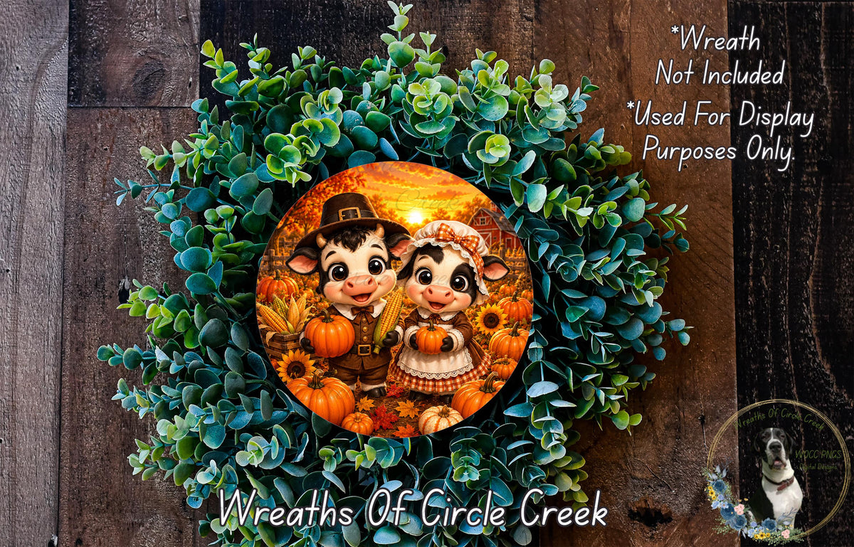 A wreath featuring two cartoon cow characters surrounded by autumn foliage, including pumpkins and sunflowers. The wreath is displayed on a wooden background, and there is a text overlay that reads "Wreath Not Included * Used For Display Purposes Only".