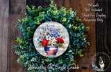 a wreath made of green leaves and flowers, with a patriotic design that includes a patriotic-themed vase and the text "Welcome" written on it.