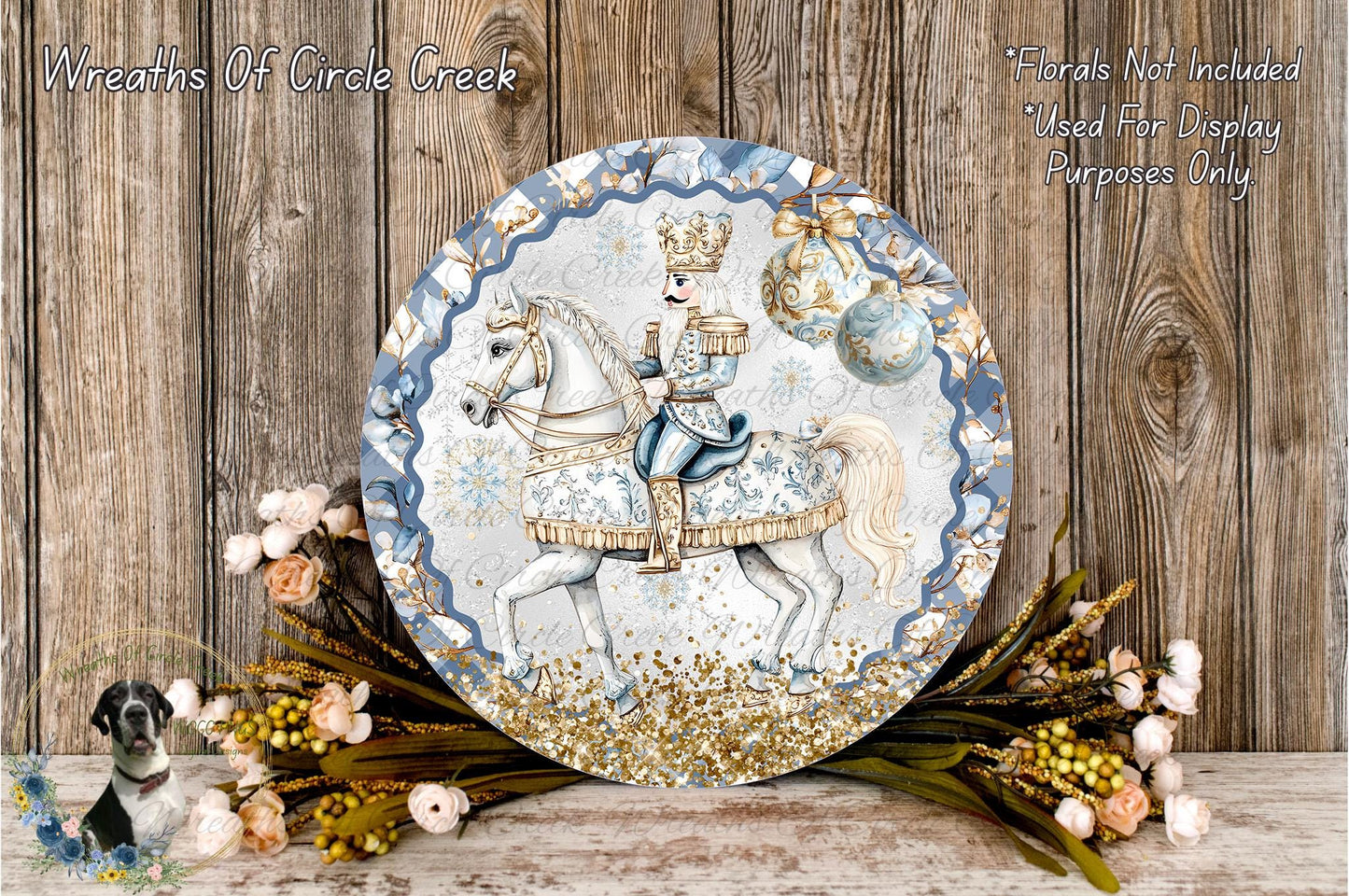 A decorative plate featuring a man in a blue and gold outfit riding a white horse, surrounded by a wreath of flowers and greenery.