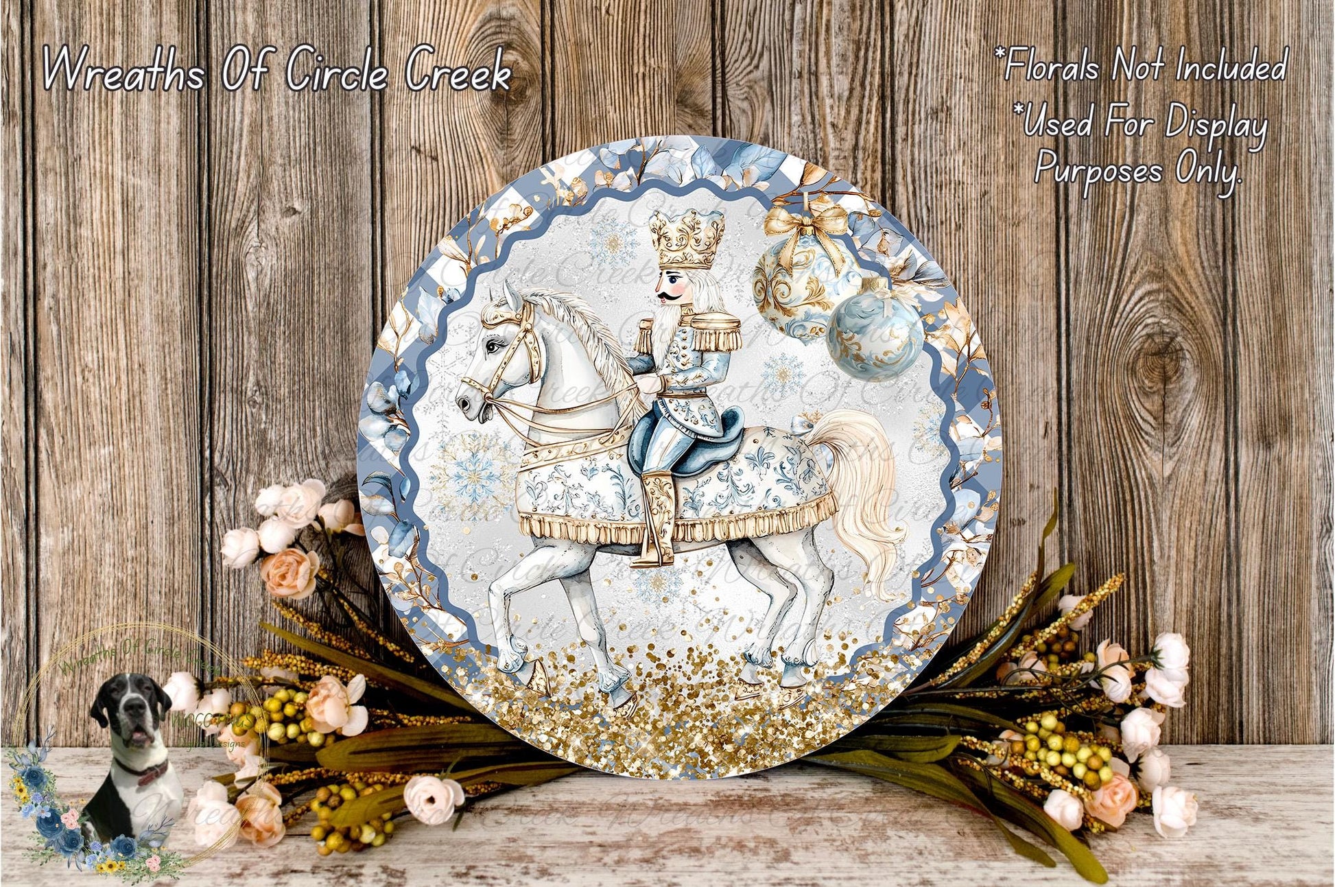 A decorative plate featuring a man in a blue and gold outfit riding a white horse, surrounded by a wreath of flowers and greenery.