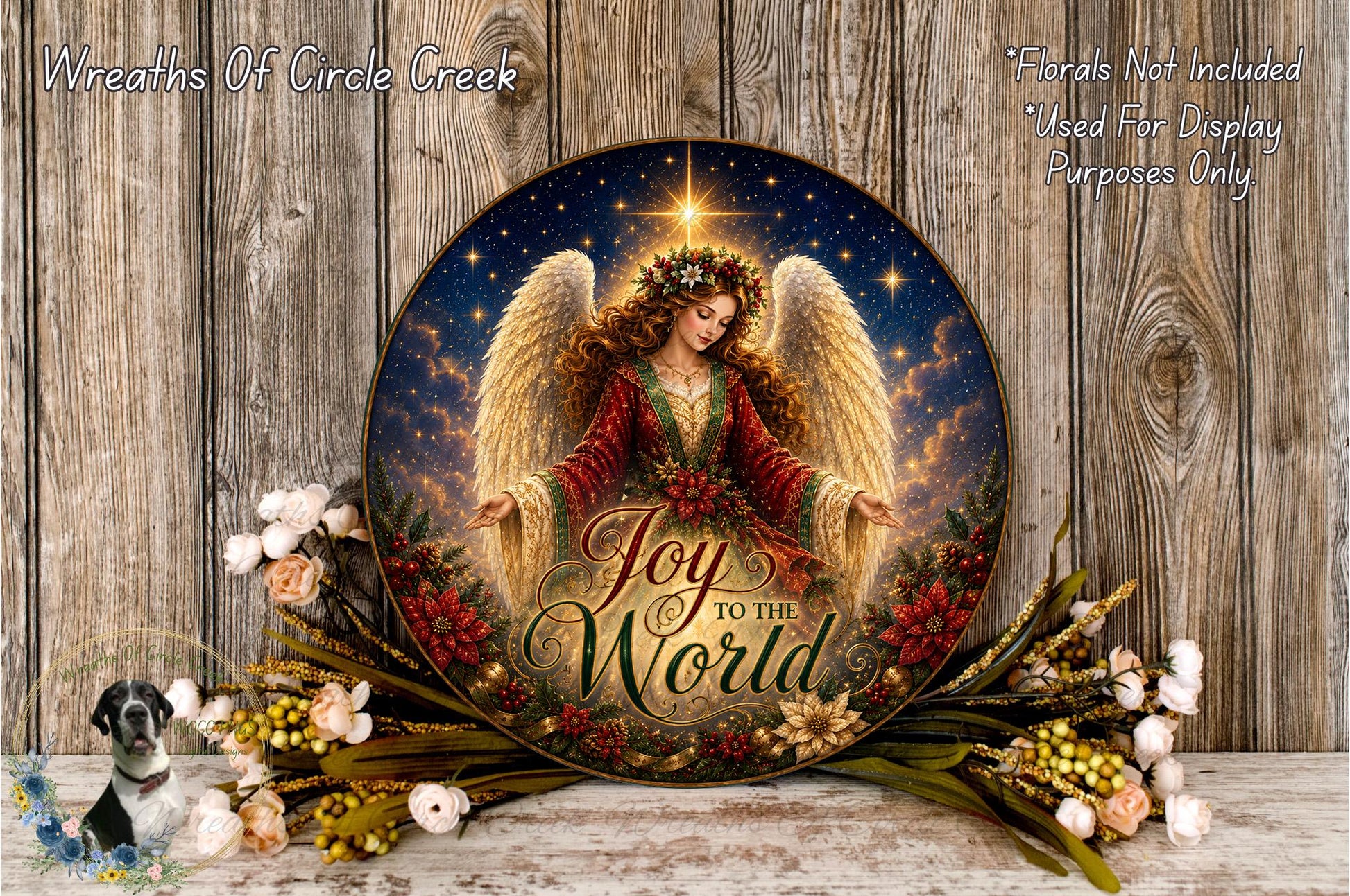 a round, decorative plate with a painting of an angel surrounded by flowers and greenery. The plate has the text "Joy to the World" written on it.
