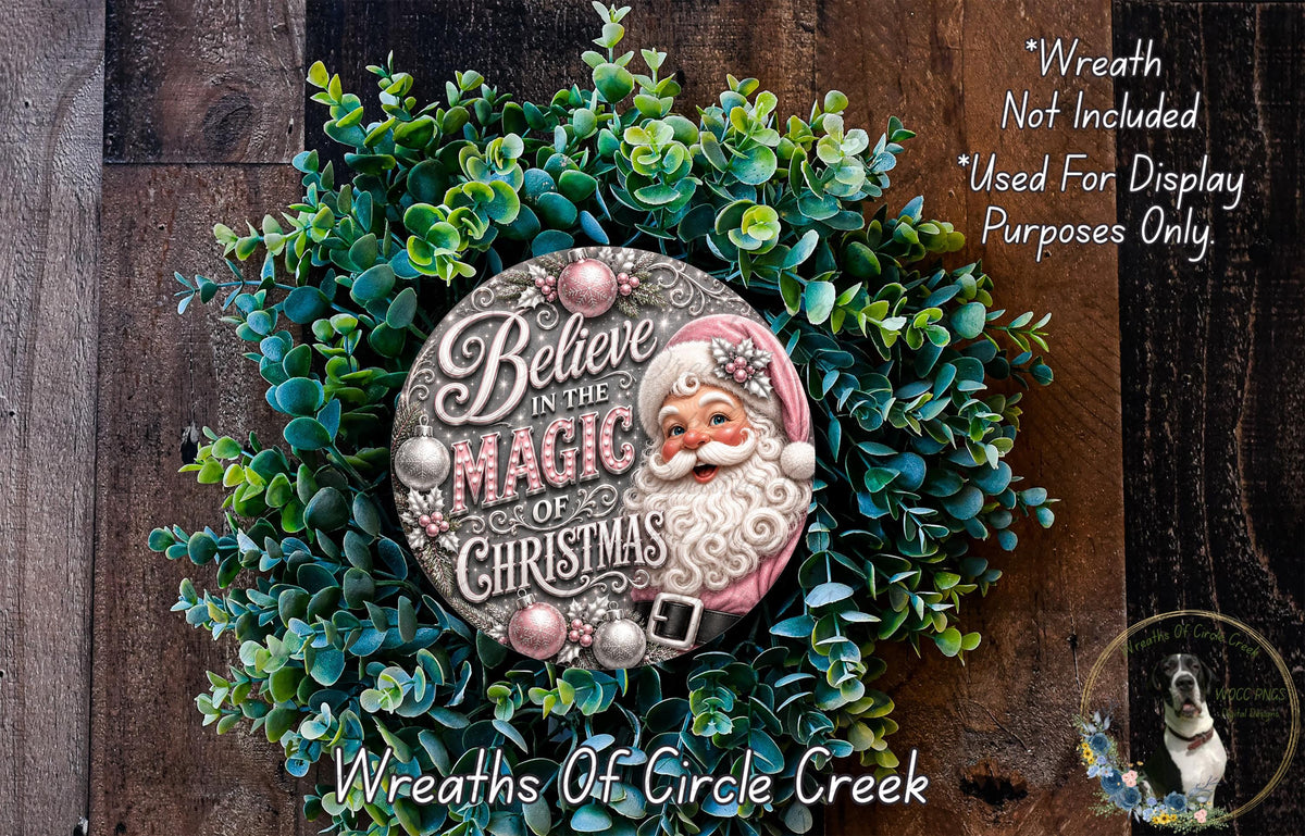 A wreath made of green leaves and a Santa Claus ornament, with the text "Believe in the Magic of Christmas" and "Wreaths of Circle Creek" written on it.