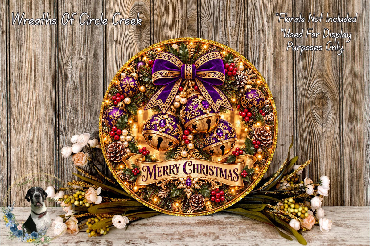 A festive Christmas wreath with a purple bow, bells, and a banner that says "Merry Christmas". The wreath is displayed on a wooden surface, surrounded by various holiday decorations such as flowers and pine cones.