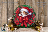 A wreath with a sleeping puppy wearing a Santa hat, surrounded by red poinsettias and a red bow, placed on a wooden surface.