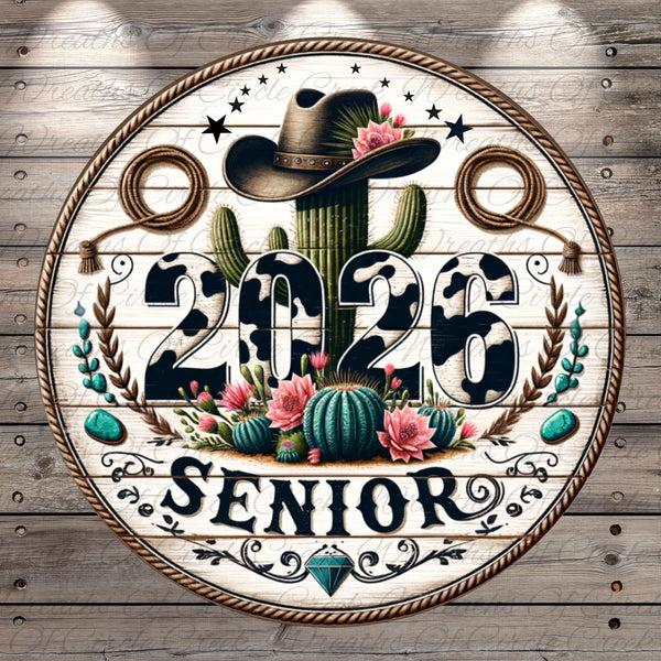 A circular sign with a cowboy hat, cactus, and floral elements, along with the text "2026 SENIOR" in a decorative font.