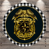a police officer's badge with a black background and a gold border. The badge has a white eagle emblem and the words "POLICE OFFICER" written on it.