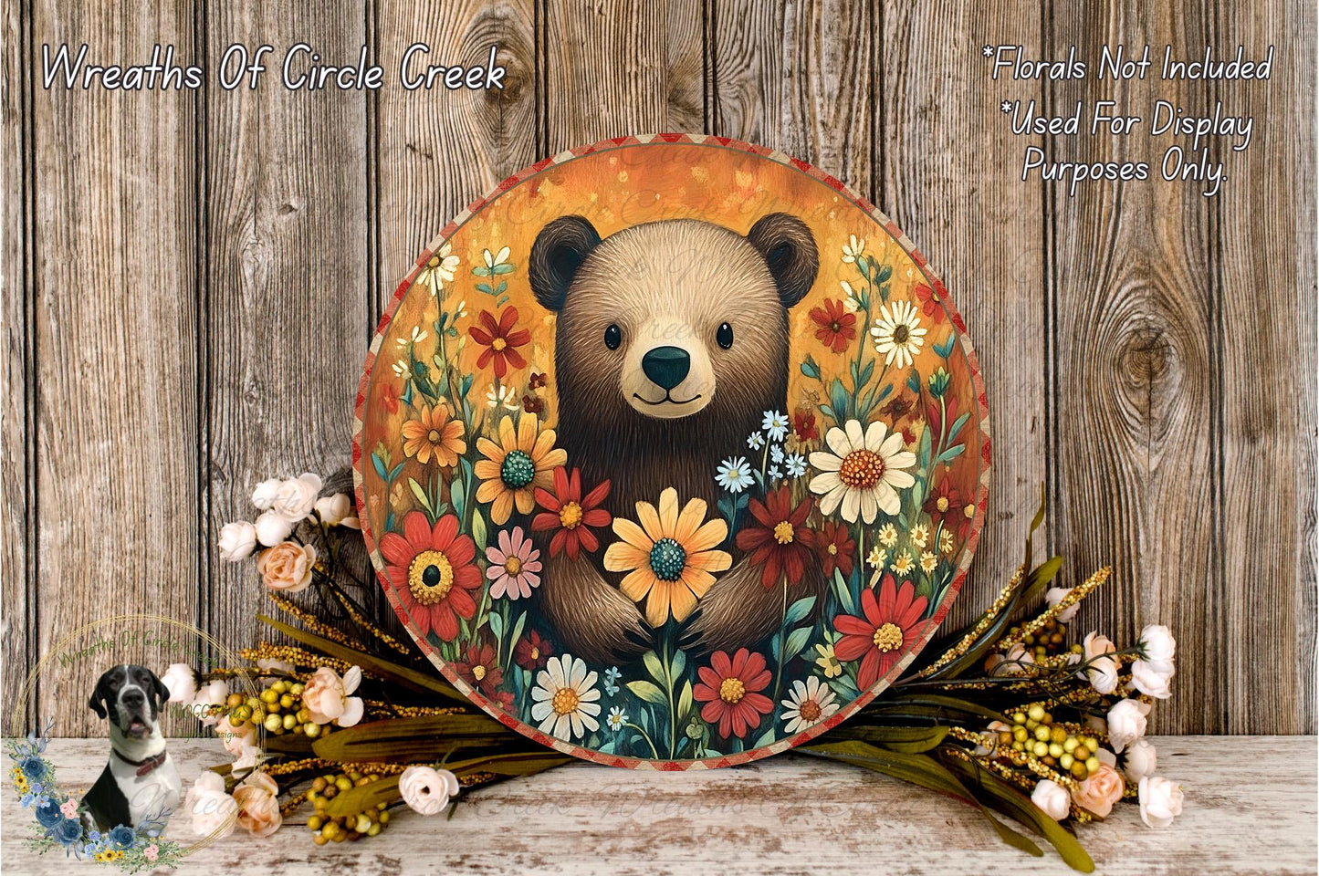 A round wooden plaque with a painted illustration of a bear surrounded by a colorful floral arrangement.