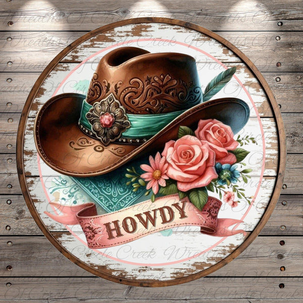 A decorative cowboy hat with a floral band and the word "HOWDY" written on it, surrounded by pink roses and other flowers.