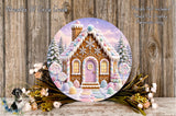 A round, decorative wreath featuring a whimsical gingerbread house with a snow-covered roof, surrounded by flowers and greenery.