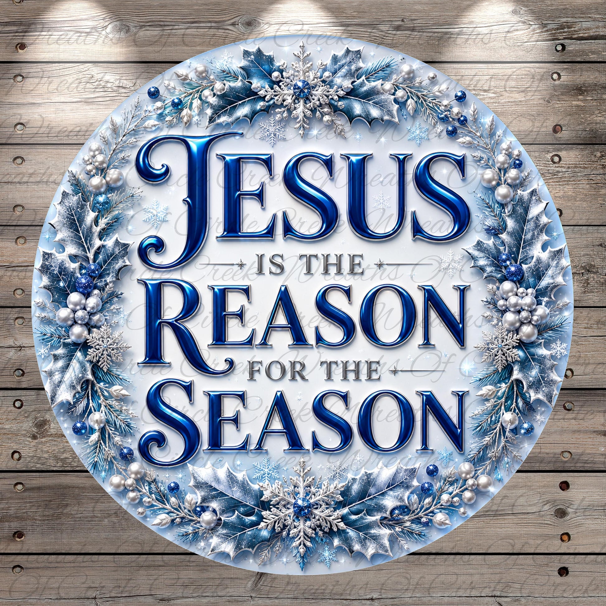 A circular sign with the text "JESUS IS THE REASON FOR THE SEASON" surrounded by a wreath of blue and silver decorations.