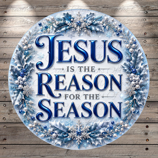 A circular sign with the text "JESUS IS THE REASON FOR THE SEASON" surrounded by a wreath of blue and silver decorations.