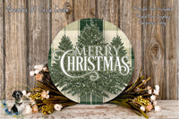 a festive Christmas-themed arrangement with a large circular sign displaying the text "Merry Christmas" surrounded by a wreath of greenery and flowers.