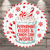 A decorative image featuring a mug with a peppermint flavor, surrounded by red and white striped candy canes and sprinkled with peppermint. The text on the mug reads "Peppermint Kisses & Candy Cane Wishes".