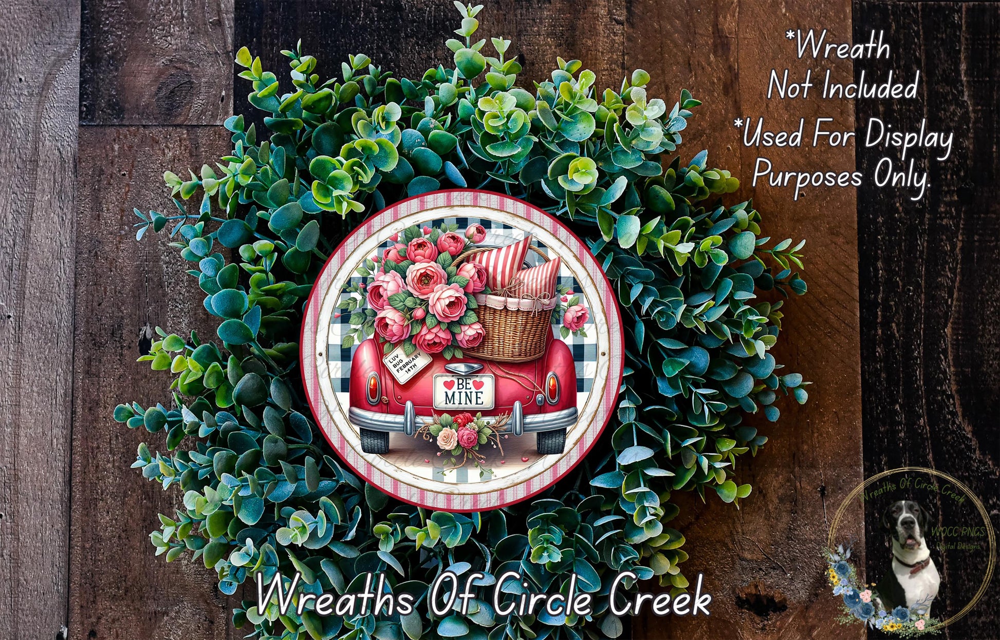 a wreath made of green leaves and flowers, with a red wagon and a basket of flowers on top of it. The wreath is displayed on a wooden surface, and there is a text overlay that reads "Wreath Not Included * Used For Display Purposes Only".