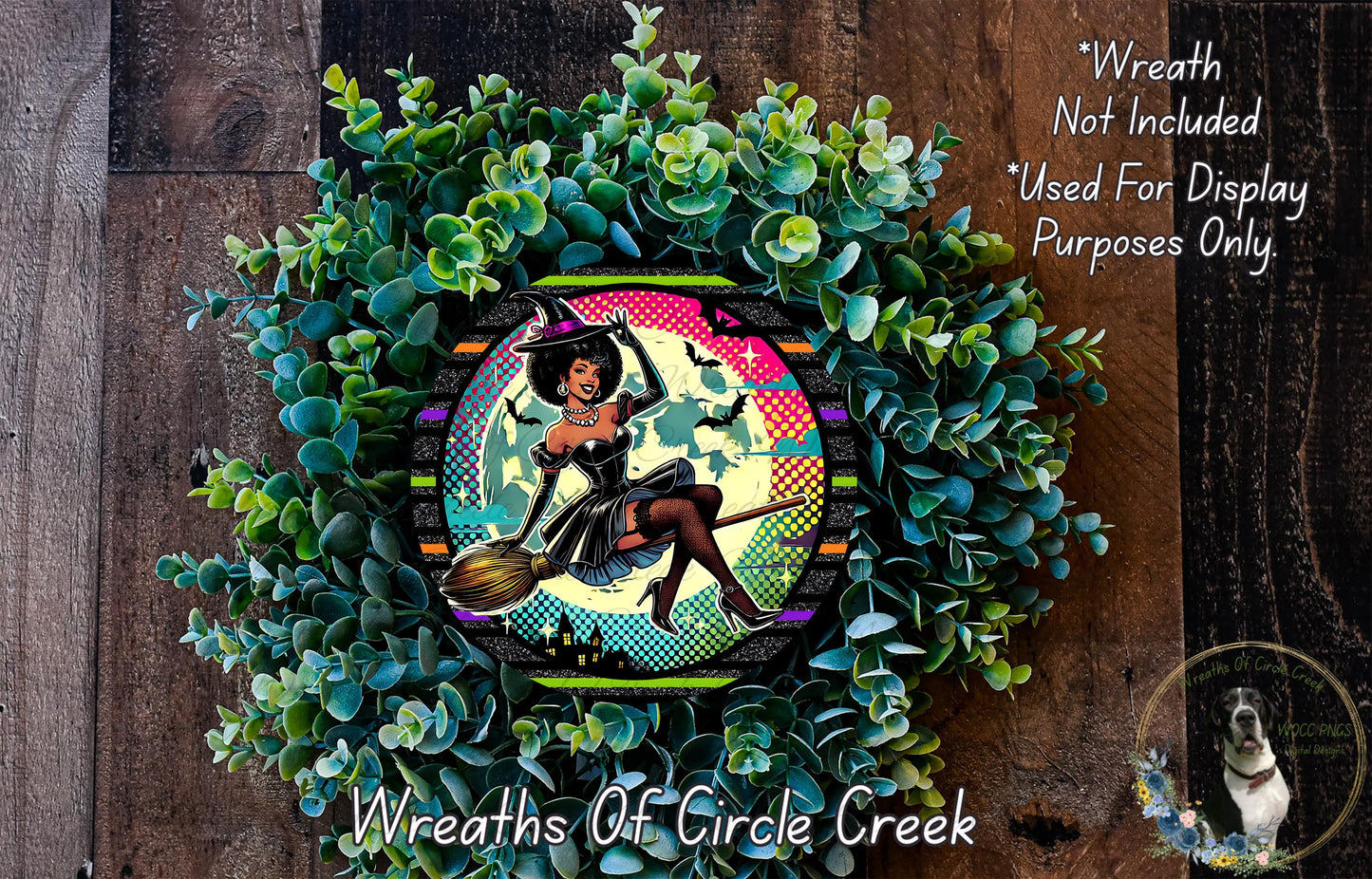 A wreath made of green plants and featuring a woman dressed as a witch, with a colorful and whimsical design.