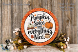a decorative pumpkin sign with the text "Pumpkin Spice and Everything Nice" against a wooden background. The sign is surrounded by a wreath of flowers and a cup of coffee, creating a festive autumnal atmosphere.