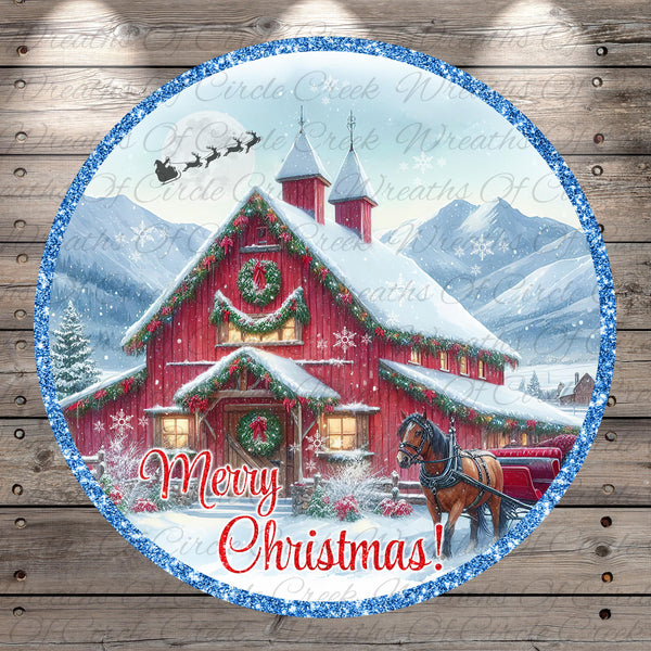 A festive Christmas scene featuring a red barn with a horse-drawn sleigh in front, surrounded by snow-covered mountains and a clear blue sky. The text "Merry Christmas!" is displayed in the center of the image.