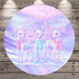 A circular image featuring three deer with antlers, set against a background of a purple and pink color scheme with stars.