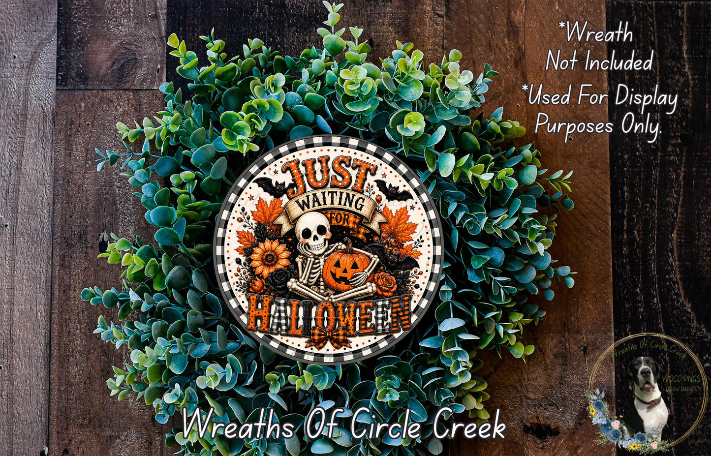 a Halloween wreath made of green foliage and a skull, with the text "Just Waiting for Halloween" displayed on it.