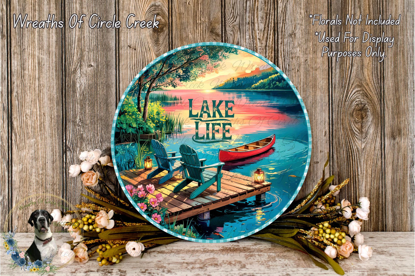 A decorative plate with a serene lakeside scene, featuring a dock, a red canoe, and a peaceful lake surrounded by trees and flowers.