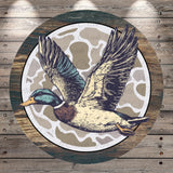 A detailed illustration of a duck in flight, with its wings spread wide, against a camouflage pattern background.