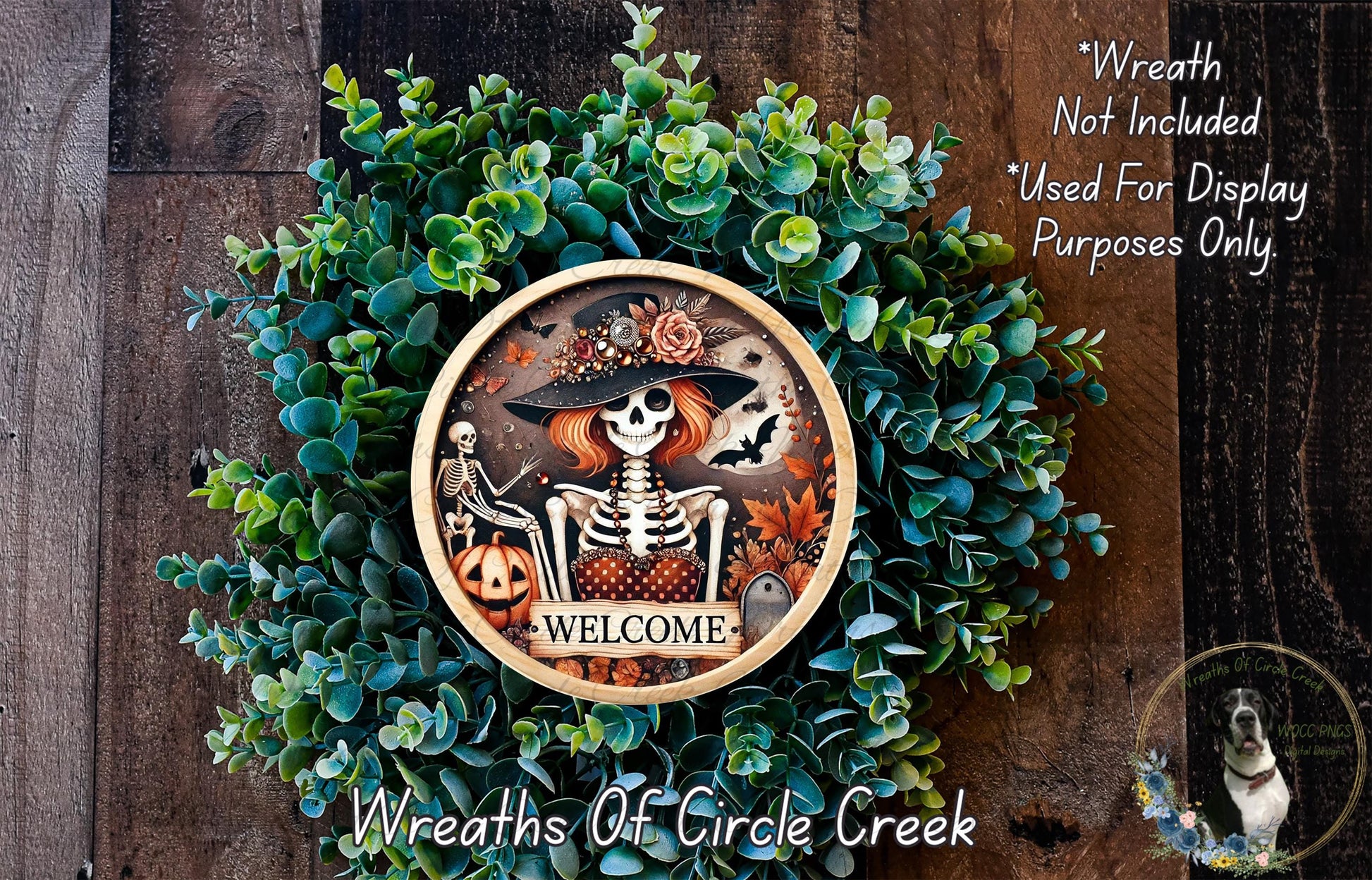 a wreath with a skeleton and a pumpkin, surrounded by greenery, and a welcome sign in the center.