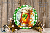 A circular green and white plate with a picture of a mug of beer and a clover leaf, surrounded by flowers and greenery.