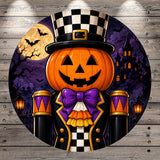 A Halloween-themed illustration featuring a jack-o-lantern wearing a top hat and a bow tie, with a castle and bats in the background.