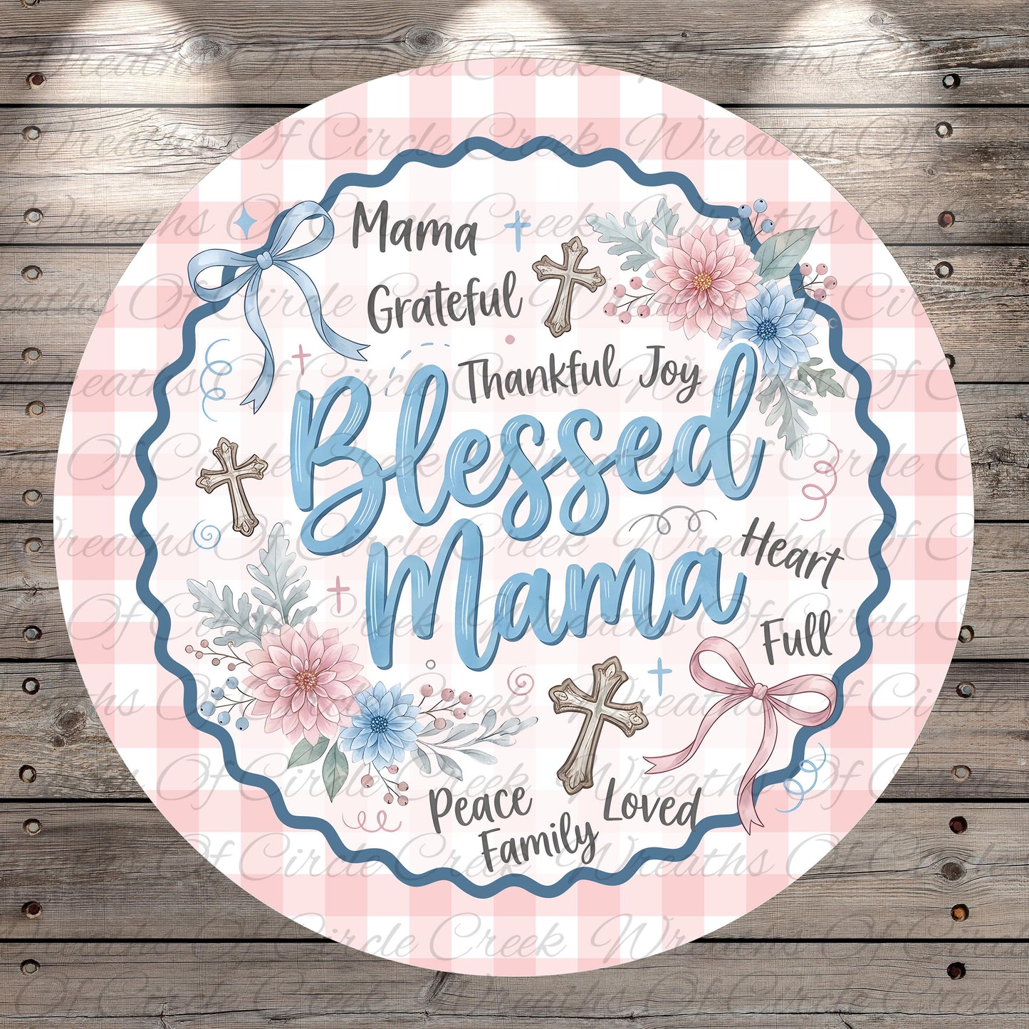 A round, decorative graphic with the text "Blessed Mama" surrounded by floral elements and crosses.