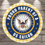 A circular emblem with the text "Proud Parent of a US Sailor" and the United States Navy seal, surrounded by stars and a chain.